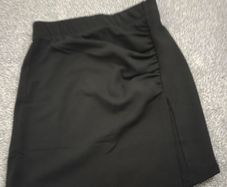 New with tags. ONLY brand black mini skirt with ruched detail and faux wrap panel. Size XS 6/8
