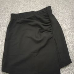 New with tags. ONLY brand black mini skirt with ruched detail and faux wrap panel. Size XS 6/8