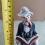 Figurine OF Old Man Sitting On Bench, Smoking His Pipe Reading Book Vintage Image 2