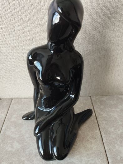 Vintage statue of a seated woman, nude figure, ceramic, glossy black.