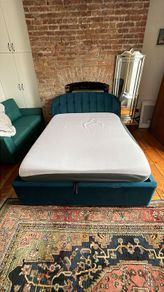 Queen-size Ottoman storage bed.
