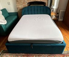 Queen-size Ottoman storage bed.