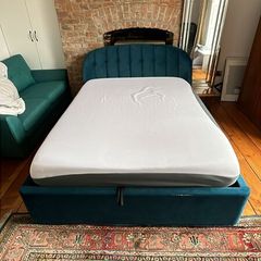 Queen-size Ottoman storage bed.