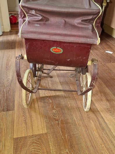 Antique Burgundy Doll's Pram, Manufactured by Walker around the 1940s, It features a Coach-Built Style Carriage with distinctive Wire-Spoke Wheels and Hard Rubber Tires Collection Only