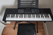 Keyboard with music stand, stand and chair. 61 keys. Barely used