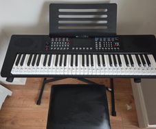 Keyboard with music stand, stand and chair. 61 keys. Barely used