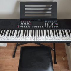 Keyboard with music stand, stand and chair. 61 keys. Barely used
