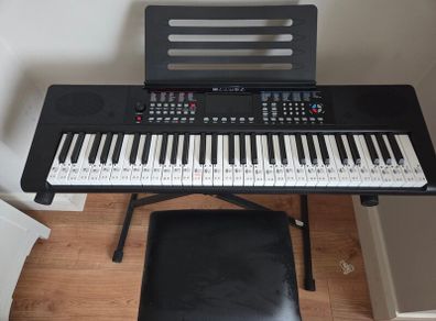 Keyboard with music stand, stand and chair. 61 keys. Barely used