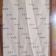 cream heavy curtains with ble & green pattern