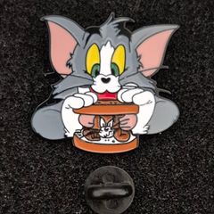 Tom and jerry , pin back badge.