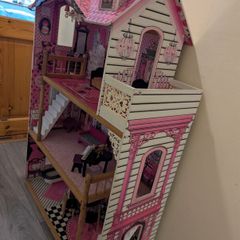 Large dollhouse with furniture and accessories