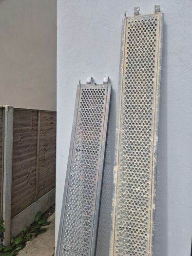 Two galvanised steel scaffolding planks