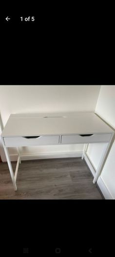 white ikea desk and two chairs