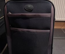 Black suitcase with brown trim