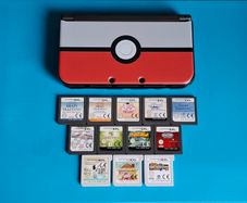 New 3DS XL Metallic Black with Games & Case