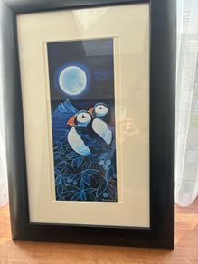 Puffins under the moon