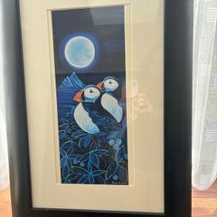 Puffins under the moon