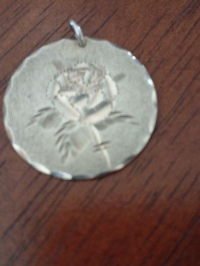 Sterling silver charm.