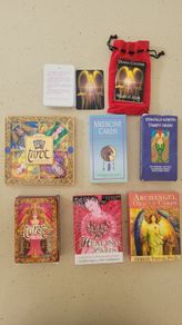 2 Tarot decks; 1 Medicine, 1healing and 1 Angel cards, one with a books and some with mini guides.