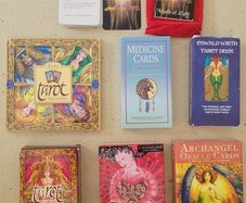 2 Tarot decks; 1 Medicine, 1healing and 1 Angel cards, one with a books and some with mini guides.