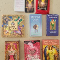 2 Tarot decks; 1 Medicine, 1healing and 1 Angel cards, one with a books and some with mini guides.