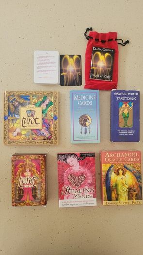 2 Tarot decks; 1 Medicine, 1healing and 1 Angel cards, one with a books and some with mini guides.