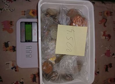 4.500 kg.coins and 9 banknotes