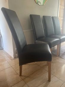 4 dark brown dining room chairs & 4 stretch covers