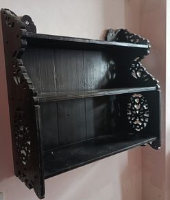 Carved wooden wall shelves