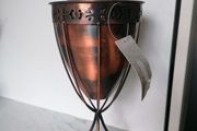 Copper-finished metal outdoor garden oil torch or tabletop tiki-style torch with a wick and stand