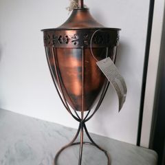 Copper-finished metal outdoor garden oil torch or tabletop tiki-style torch with a wick and stand