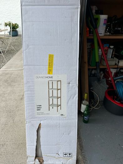 shelf unit. This is a neat open shelf unit suitable for a bathroom or kitchen. It is brand new. I haven't even opened the box.