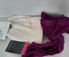 New child's white beanie hat and scarf tag attached