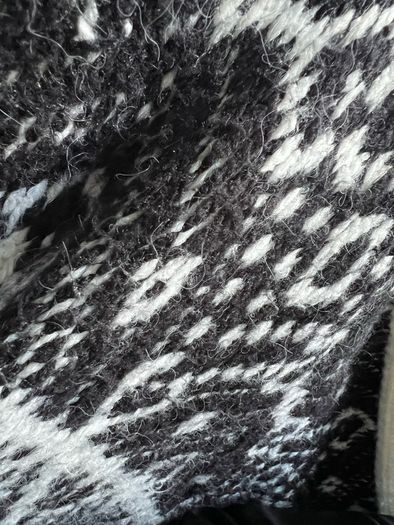 Reversible knitted piece cardigan, a structured jacket, or a coat. Very warm.
