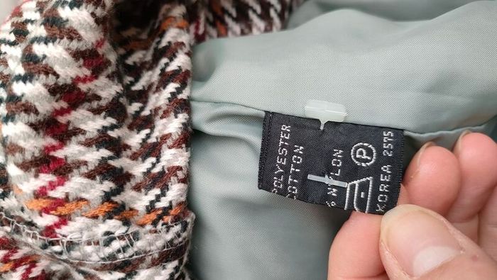 Vintage Nuage ladies trenchcoat Approximately late 90s early 00s Size 10 on label The colour is a pale bluey grey with brown buttons It's got an inner lining that can be removed