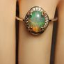 Ethiopian Welo Opal and Lab Grown Diamond Oval Cluster Ring. Image 6