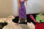 Pre-loved female doll plus clothes