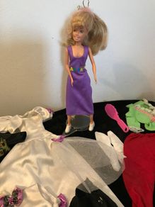 Pre-loved female doll plus clothes