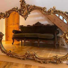 Elegant ornate gold toned oval wall mirror