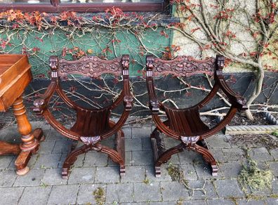 A pair of savonarola chairs