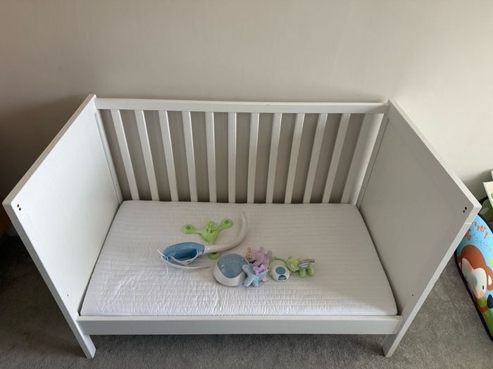cot bed with mattress and remote toy