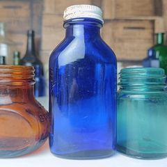 457 - Set of Three Beautiful Vintage Glass Decorative Collectible Bottles - Amber Eire Bovril, Cobalt Blue Magnesia and Turquoise Science Cream