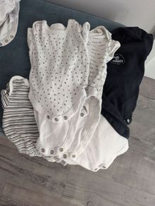 Six newborn vests