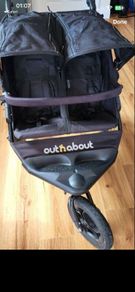 Out n about double buggy with raincover