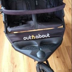 Out n about double buggy with raincover