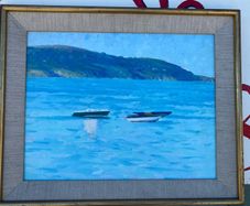 Seascape depicting small boats moored in a calm harbour with hills in the background unsigned