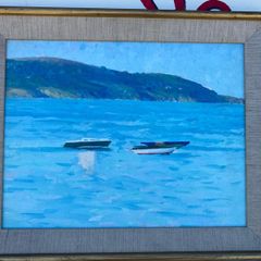Seascape depicting small boats moored in a calm harbour with hills in the background unsigned
