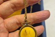 Unique Item. Antique pendant with a faded picture of a lady.