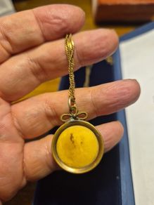 Unique Item. Antique pendant with a faded picture of a lady.