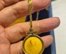 Unique Item. Antique pendant with a faded picture of a lady.